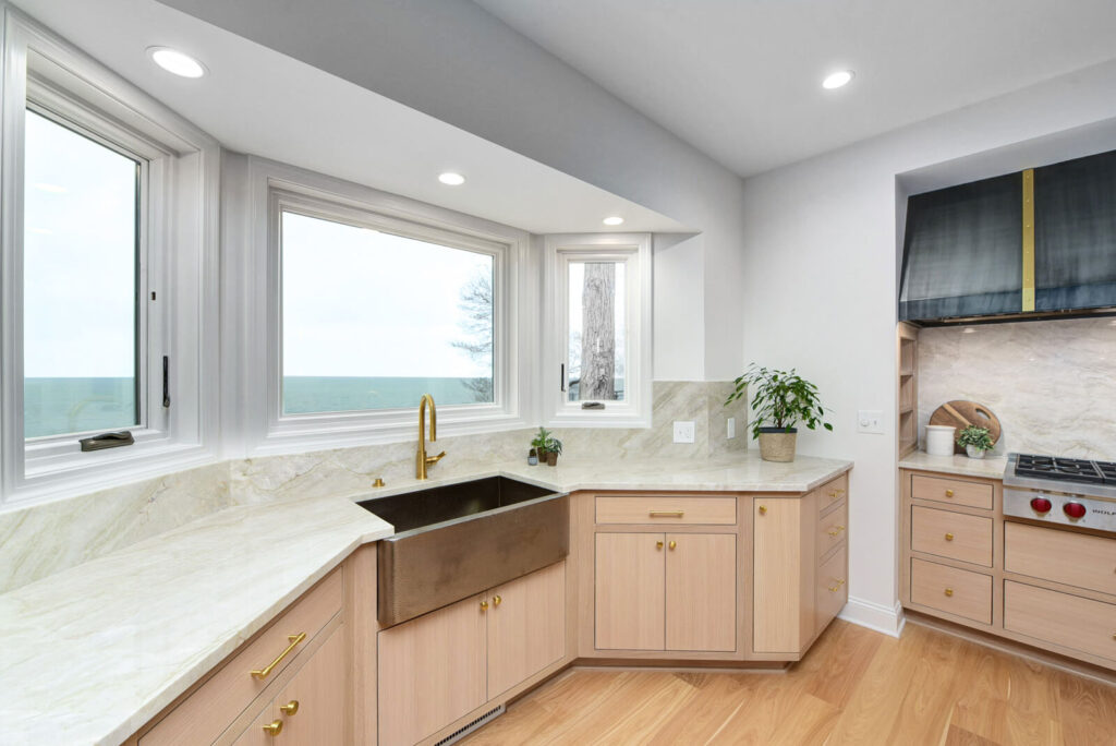 A kitchen featuring a sink, countertop, and a window allowing natural light to illuminate the space.